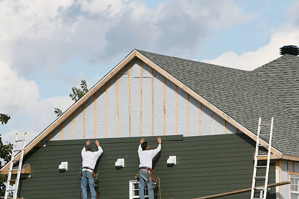 Professional Storm Damage Siding Repair technician working in Beccaria, PA